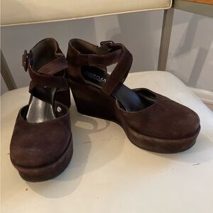 Brown suede wedge heel.